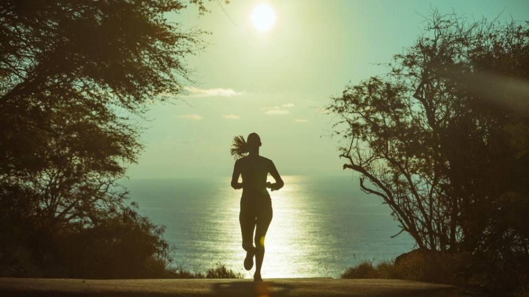lady running down a road