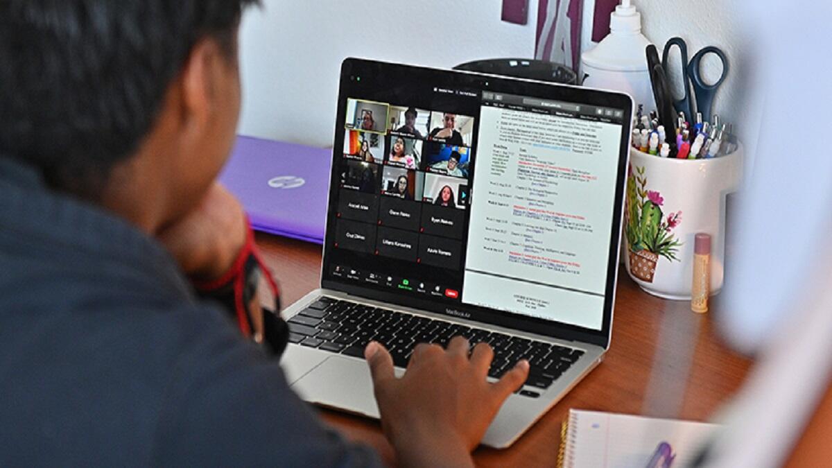 Learner doing online school on a laptop, Learner on zoom 