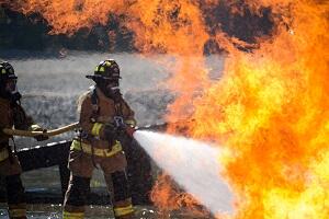 firefighters hosing a fire 