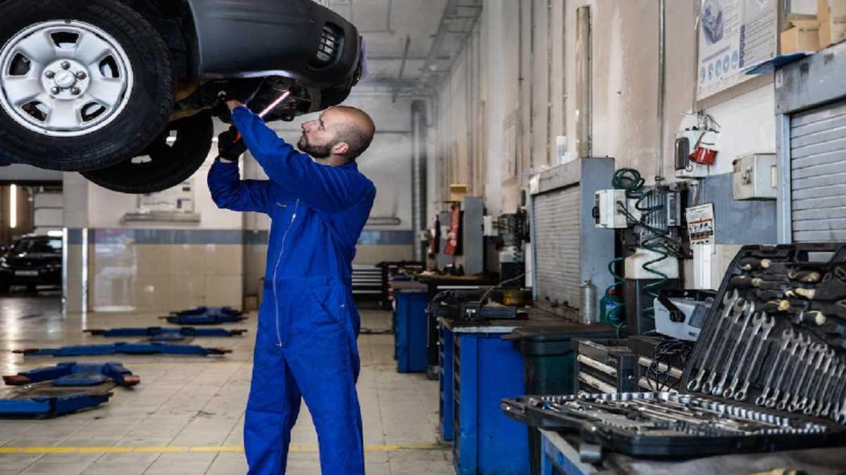 A mechanic working on a car engine 