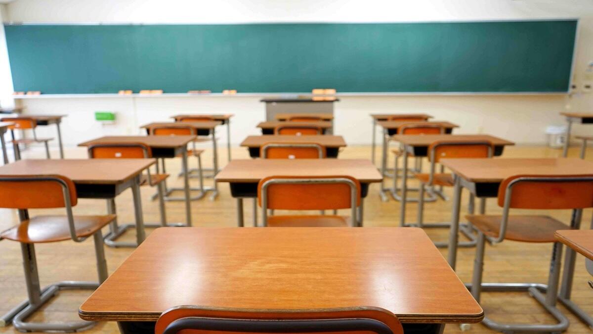 A Classroom with tables and chairs